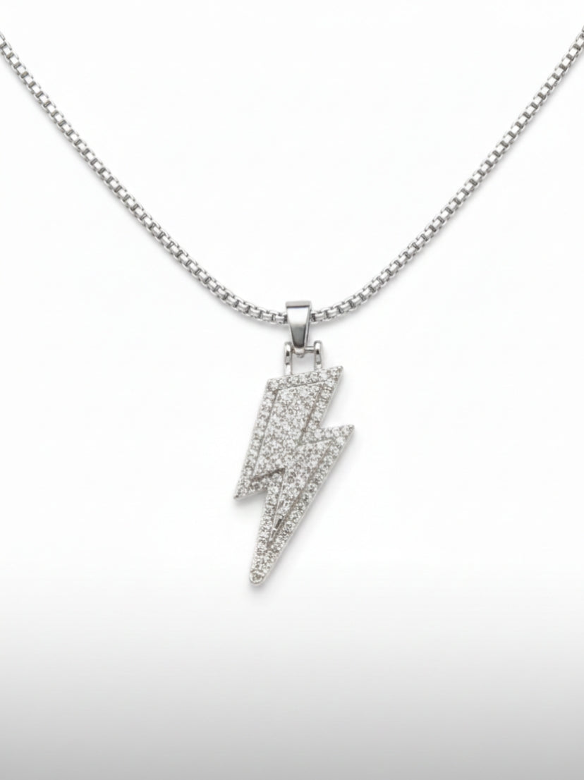 Silver lightning bolt pendant on a chain against a white background